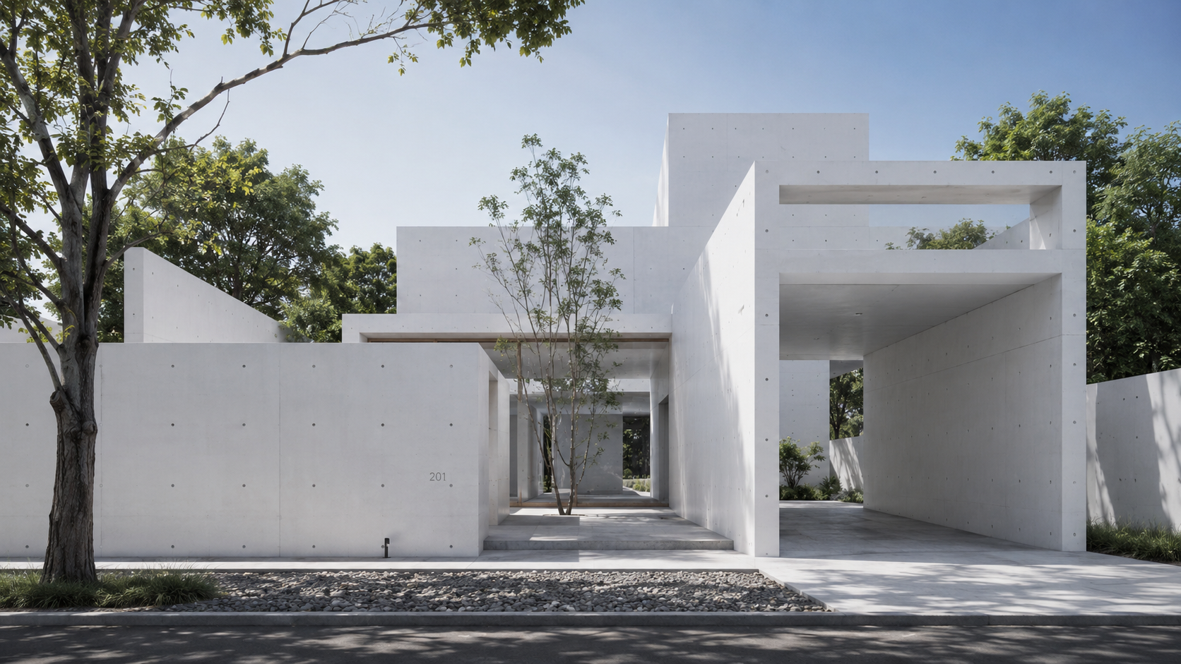 Casa de hormigón blanco entre árboles